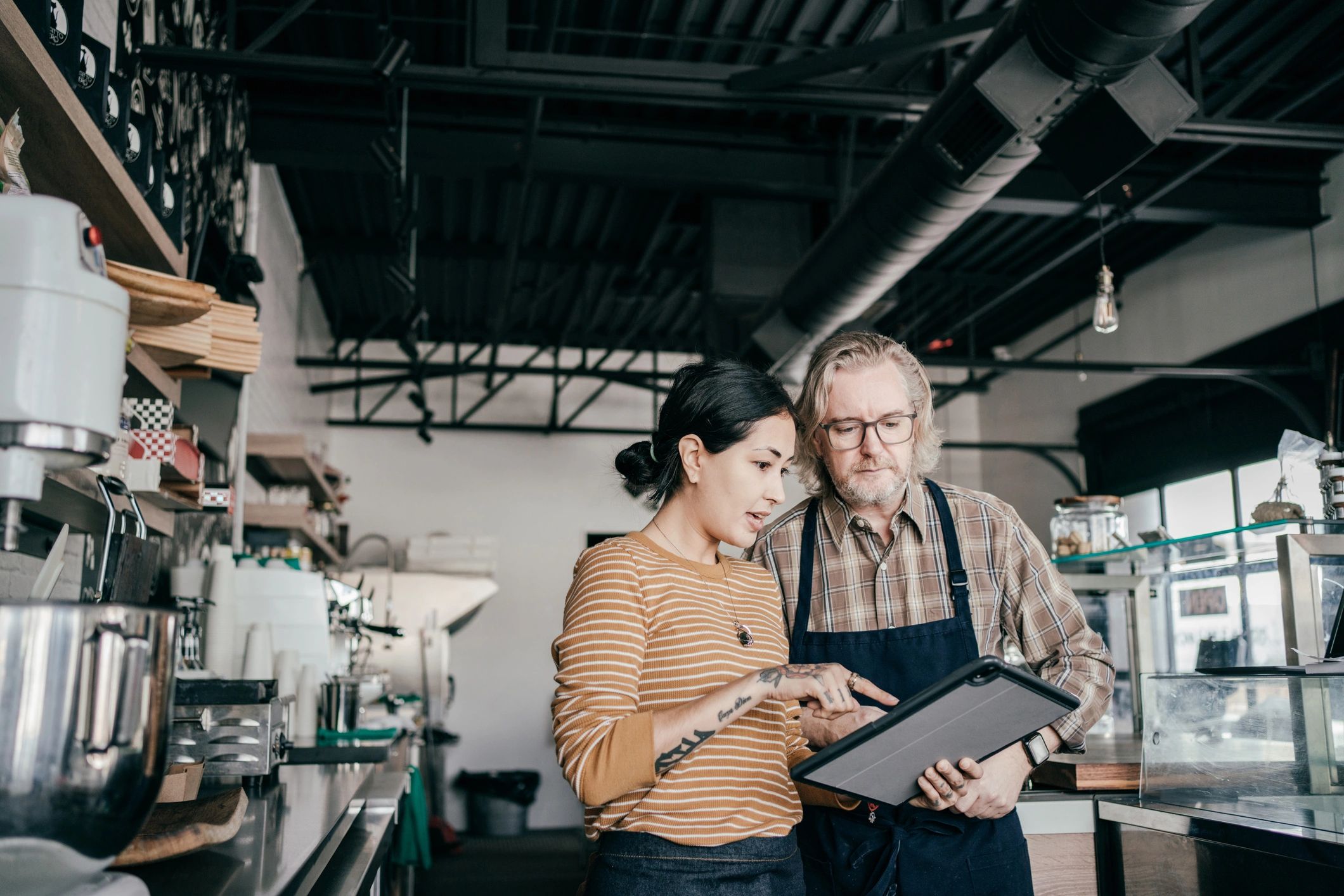 Marketing consultant speaking with a local business owner