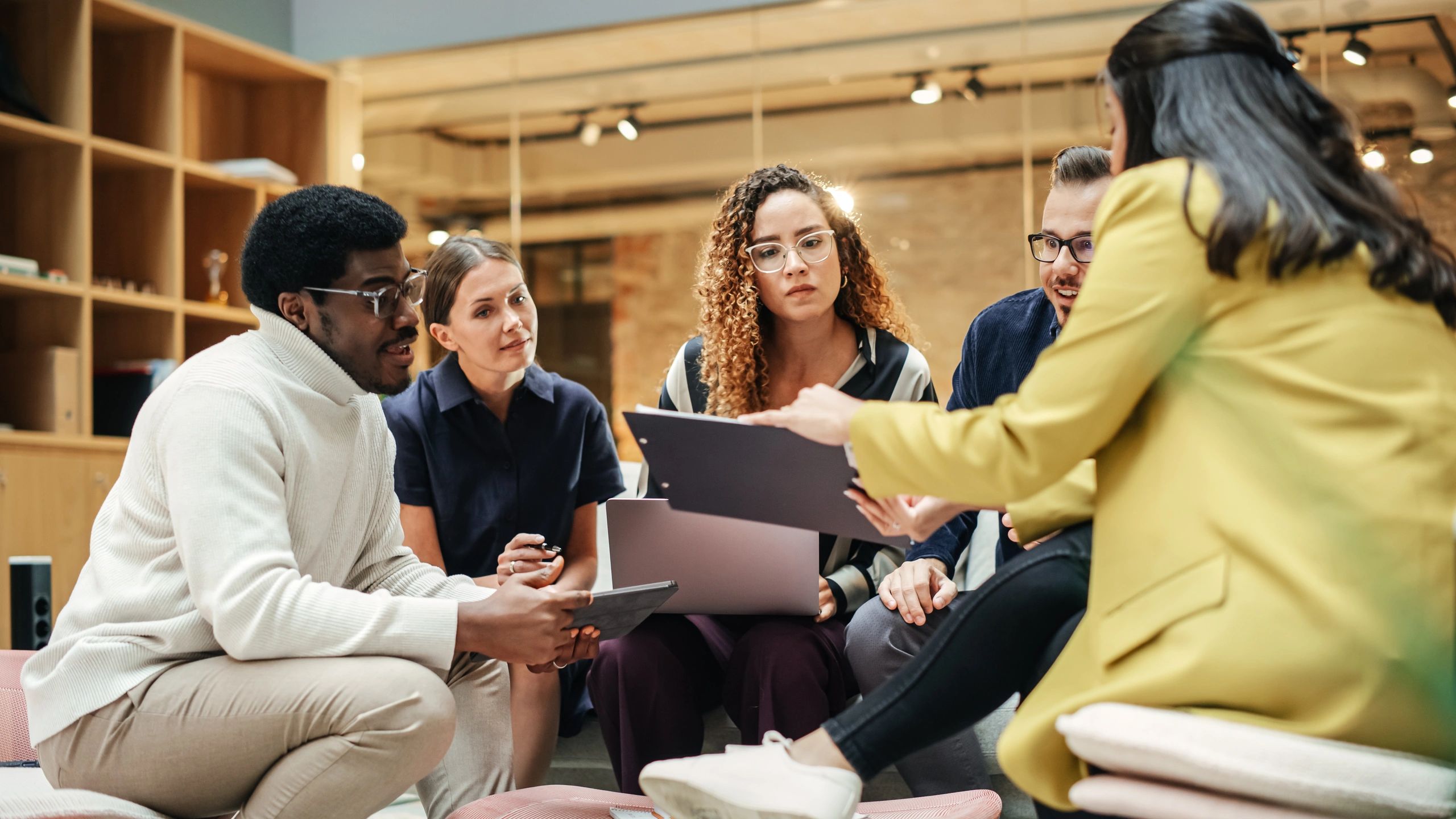 Marketing team collaborating in a modern meeting room