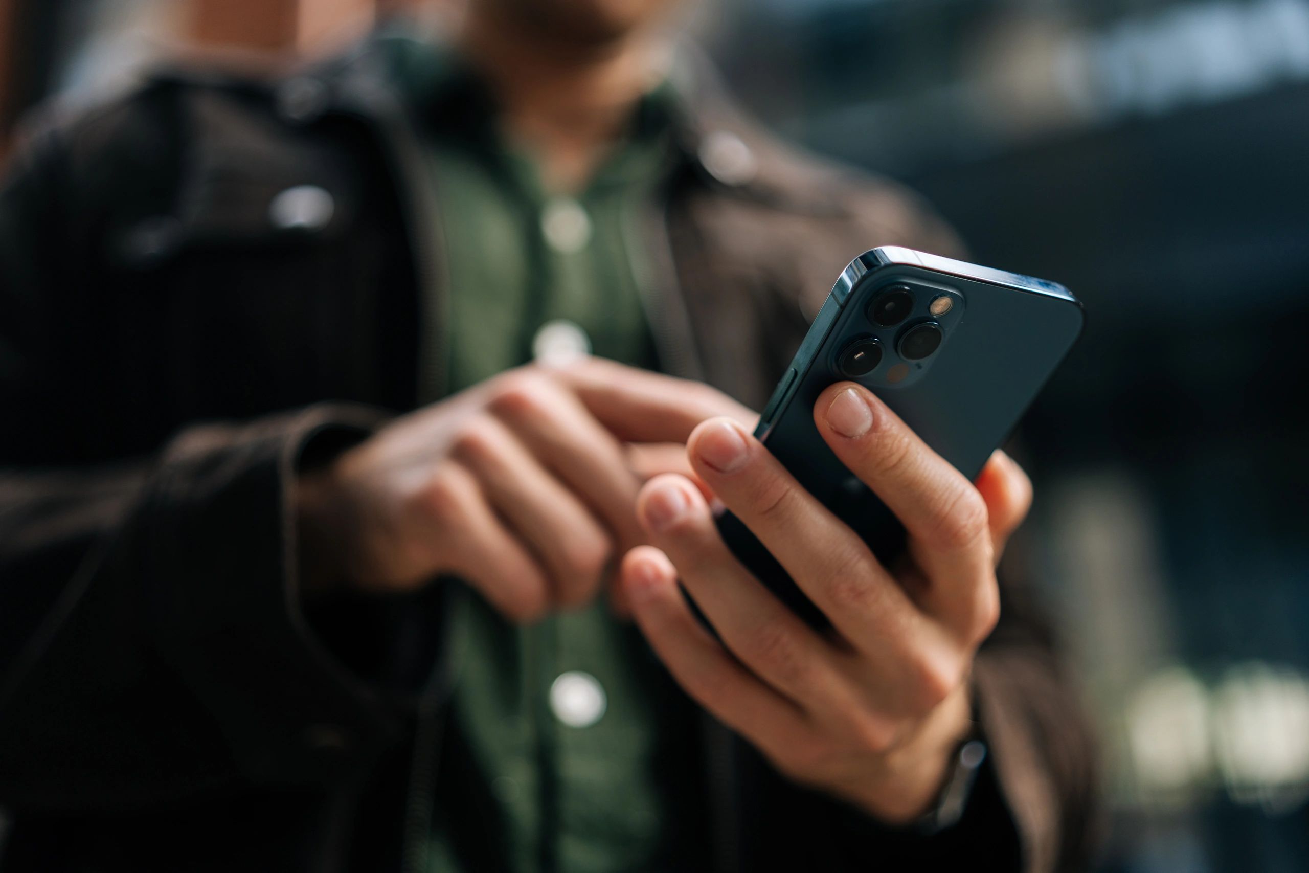 Hands using a smartphone for business messaging