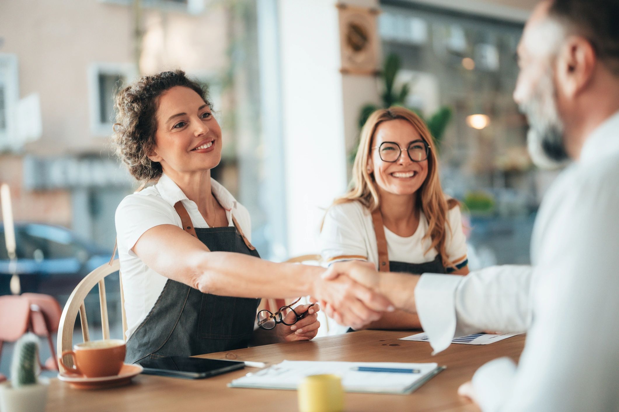 Small business owners meeting to review growth plans