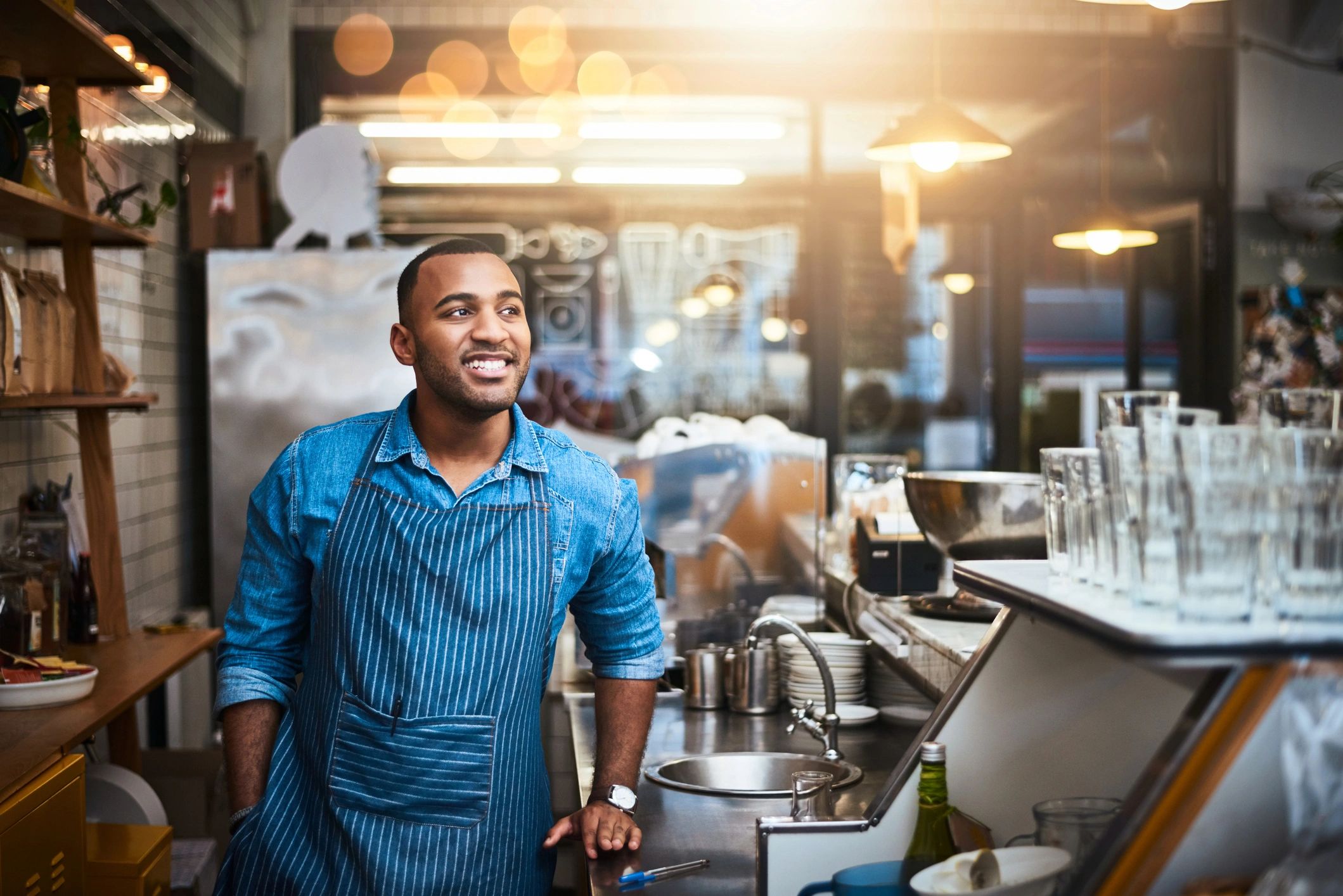 Small business owner working confidently in a shop